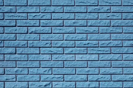 Blue brick wall texture, stone background. Decorative modern tile for facade finishing. Abstract architectural pattern. Building facade design.の写真素材