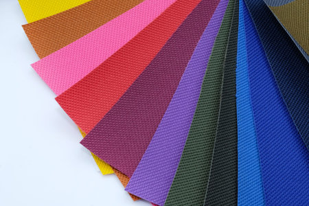 The palette of colors on a white background. Samples of fabric in different colors. Thick fabric for...