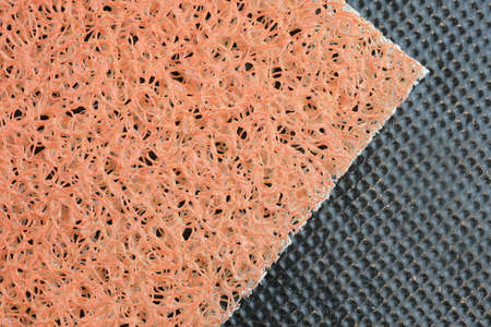 Front door mat on a rubber base top view. Close-up of a mat for wiping away dirt on the sole.の写真素材