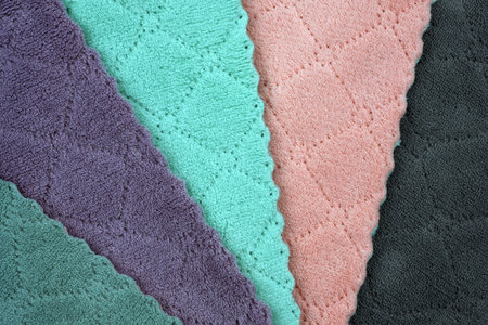Colored microfibre cloth. stacked colorful microfiber cleaning cloths background. Cleaning wipes...
