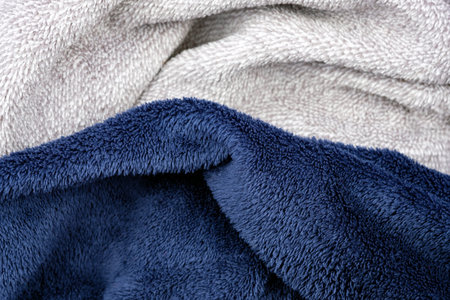 Soft plush fabric close up. Blue and gray pile, unnatural fabrics for decorative pillows. Low-pile...