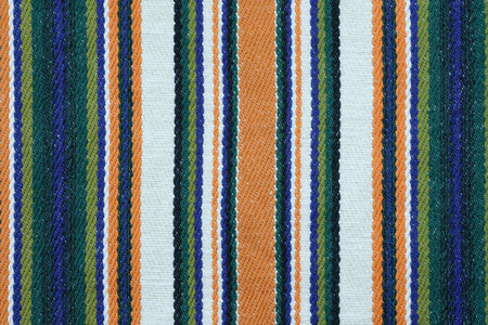 Color linen fabric with a thin strip, background. Linen fabric texture. Kitchen towel close-up. Home...