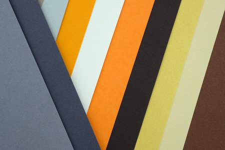 Abstract background from sheets of orange, and gray paper. Abstract paper - colorful background,...