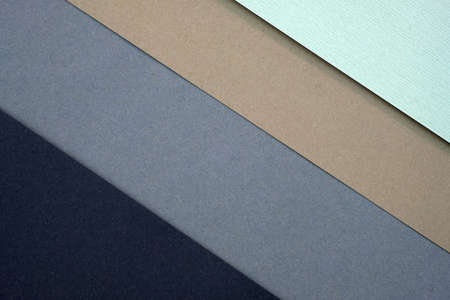 Paper background with diagonal lines. Different colors of paper top view. Black, gray, brown diagonal lines, pastel colors.の写真素材