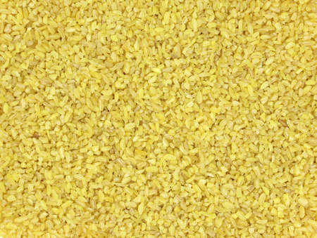 Bulgur groats from crushed wheat close-up. Bulgur background. Durum wheat top view.の写真素材