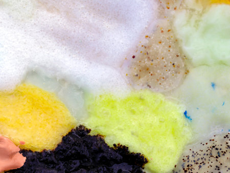 Composition of various cosmetic creams and scrub textures. Various cosmetic smears top view. Texture of smudge cosmetic cream foundation liquid background. Closeup of a sample of a cosmetic product.の写真素材