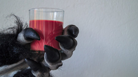 Hairy claw catching a glassの写真素材