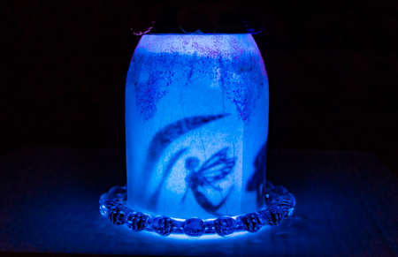 Illuminated fairy house at nightの写真素材