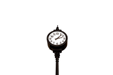 Black wrought iron vintage clock on a white background.