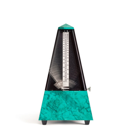 Moving pyramid shaped metronome in plastic housing in sapphire green with marble effect isolated on whiteの写真素材