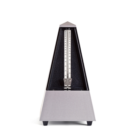 Stopped pyramid shaped metronome in plastic housing isolated on whiteの写真素材