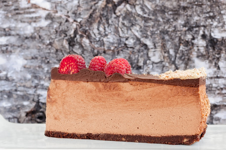 Lateral view of low carb no bake raspberry chocolate cheesecakeの写真素材