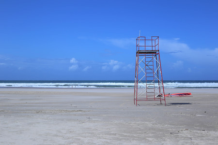 Empty beach lifeguard chairの写真素材
