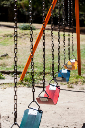 Empty colorful swings at the park