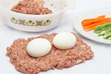 Preparing and filling the Egg and Vegetables stuffed meatloafの写真素材