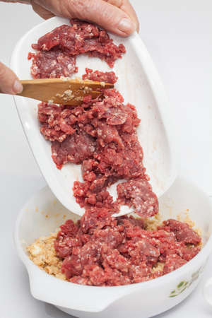 Preparing the mix for the stuffed meatloafの写真素材