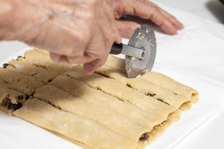 Cutting coconut filled sticksの写真素材