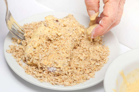 adding crumbled crackerの写真素材