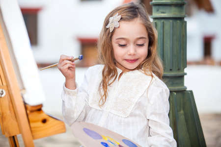 Little artist creating a paintingの写真素材