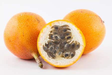 Sweet granadilla (Passiflora ligularis) isolated in white backgroundの写真素材