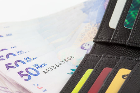 Black wallet filled with money and cardsのeditorial素材