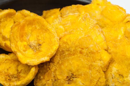 Plantain cups and patacones on white background