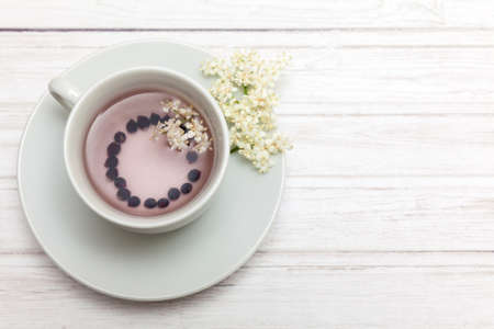 Elderberry (Sambucus nigra) infusion in waterの写真素材