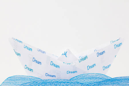 Origami boat: follow your dreams conceptの写真素材