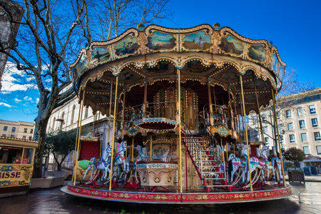 French old-fashioned style carousel with stairs at Place de l'Horloge in Avignon Franceのeditorial素材