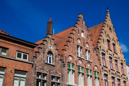 BRUGES, BELGIUM - MARCH, 2018: Houses representative of the traditional arquitecture of the historical Bruges townのeditorial素材