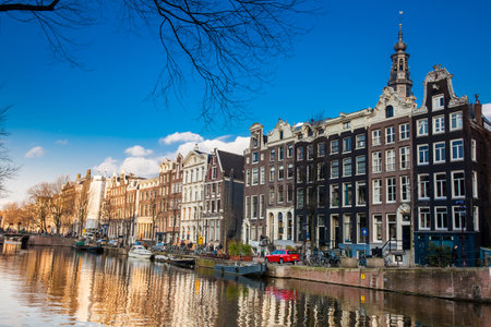Canals, boats and beautiful architecture at the Old Central district in Amsterdamのeditorial素材