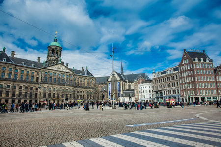 Dam Square and the Royal Palace at the Old Central district of Amsterdam in a cold early spring dayのeditorial素材