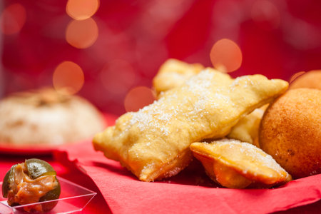 Traditional Colombian christmas dishes on red background