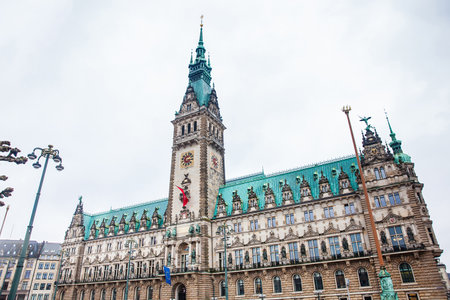 Hamburg City Hall buildiing located in the Altstadt quarter in the city center at the Rathausmarkt square in a cold rainy early spring dayのeditorial素材