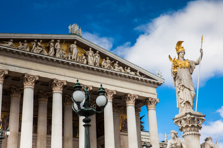 The Athena Fountain in front of the historical Austrian Parliament Building completed in 1883 and located on the Ringstrabe boulevard in the first district of Viennaのeditorial素材