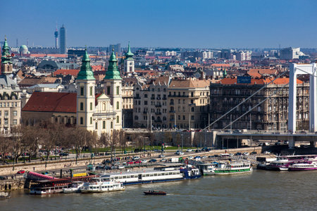 View of the Pest side of Budapest city, Elisabeth Bridge and the Parochial Church of the Assumption of the Virginのeditorial素材