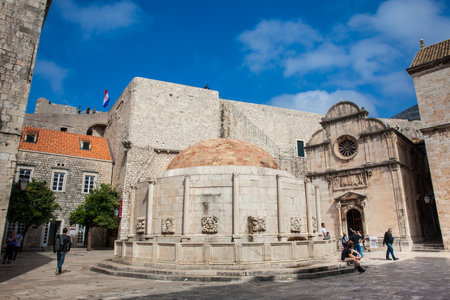 DUBROVNIK, CROATIA - APRIL, 2018: Tourists at the Large Onofrio Fountain located at Stradun street in the old town of Dubrovnikのeditorial素材