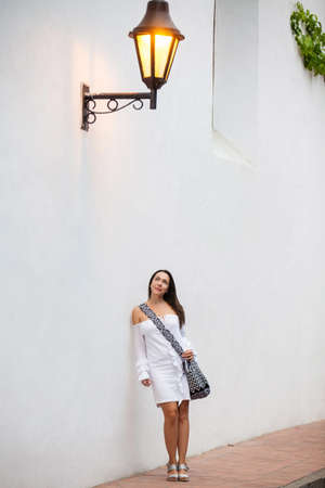 Beautiful woman at the streets of the walled city in Cartagena de Indiasの写真素材