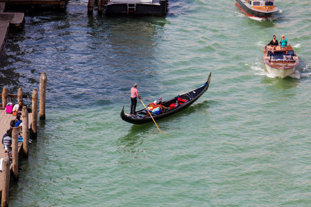 Tourists sailing in the gondola on the Grand Canal of Venice in an early spring dayのeditorial素材