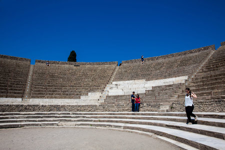 Tourists at the Great Theater of Pompeii