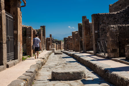The beautiful streets of Pompeii made of large blocks of black volcanic rocksのeditorial素材