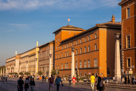 Tourists and locals at the Road of the Conciliation in the Vatican City in a beautiful early spring sunsetのeditorial素材