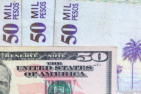 Exchange rate between US dolar and Colombian peso in 2019. More than 3000 pesos each dolarの写真素材