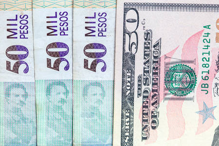 Exchange rate between US dolar and Colombian peso in 2019. More than 3000 pesos each dolarの写真素材