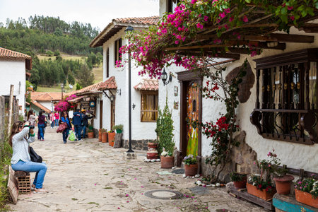 Tourists visiting the beautiful touristic place called Pueblito Boyacense located in Duitamaのeditorial素材