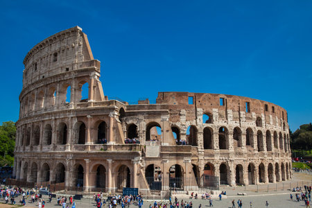 Tourists visiting the famous Colosseum in Rome on a beautiful early spring dayのeditorial素材
