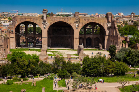 Tourists at the Basilica of Maxentius and Constantine in the Roman Forum in Romeのeditorial素材
