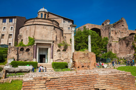ROME, ITALY - APRIL, 2018: Tourists visiting the ancient Romulus Temple at the Roman Forum in Romeのeditorial素材