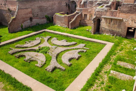 Courtyard garden of the ancient ruins of the Domus Augustana on Palatine Hill in Romeの写真素材