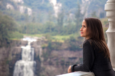 Female tourist visiting the famous Tequendama Falls located southwest of BogotÃ¡ in the...